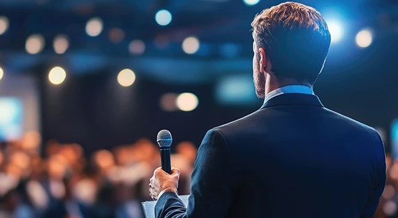 Confident speaker presenting to audience